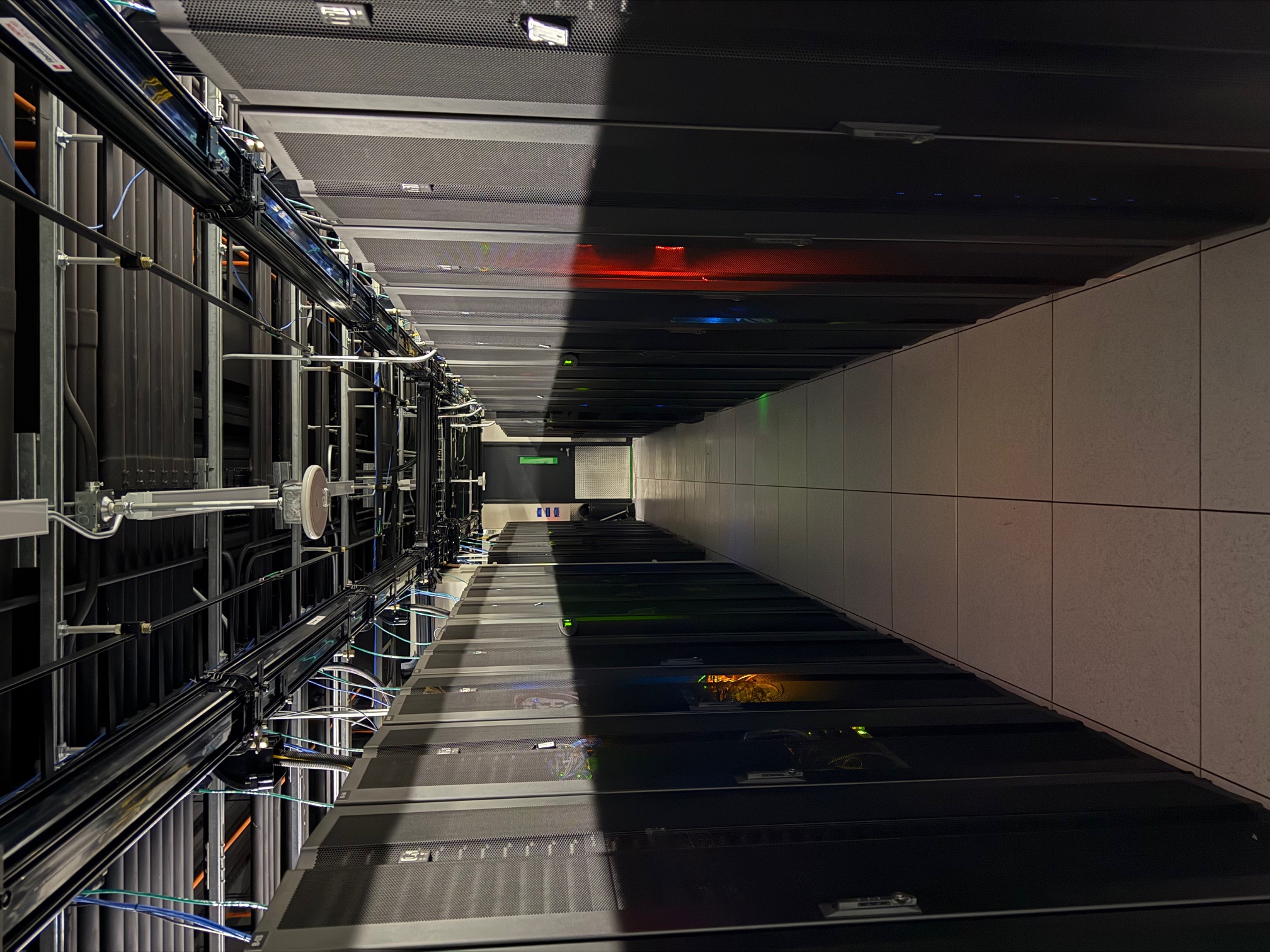 Server cabinets with multicolored status LEDs in the cold aisle